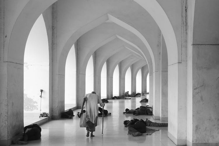 Men Lying On The Ground In Baitul Mukarram