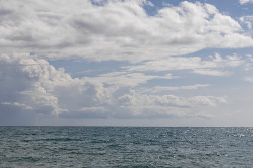 Ocean under the Cloudy Sky