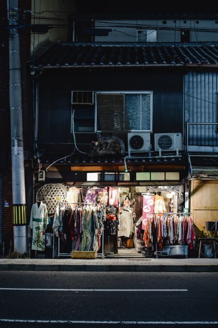 Charming street view of traditional kimono shop in Kyoto at night.