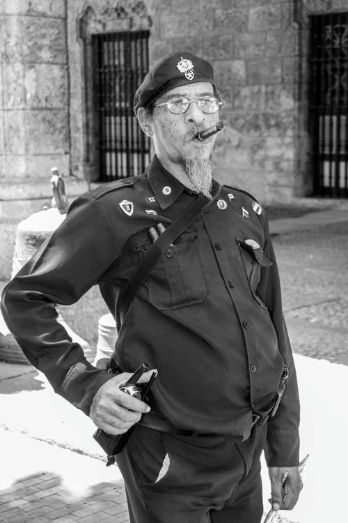 Police Officer in Uniform Smoking Cigar · Free Stock Photo