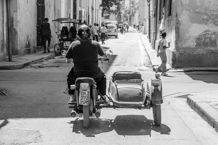 Man Riding On A Vintage Motorcycle With A Sidecar