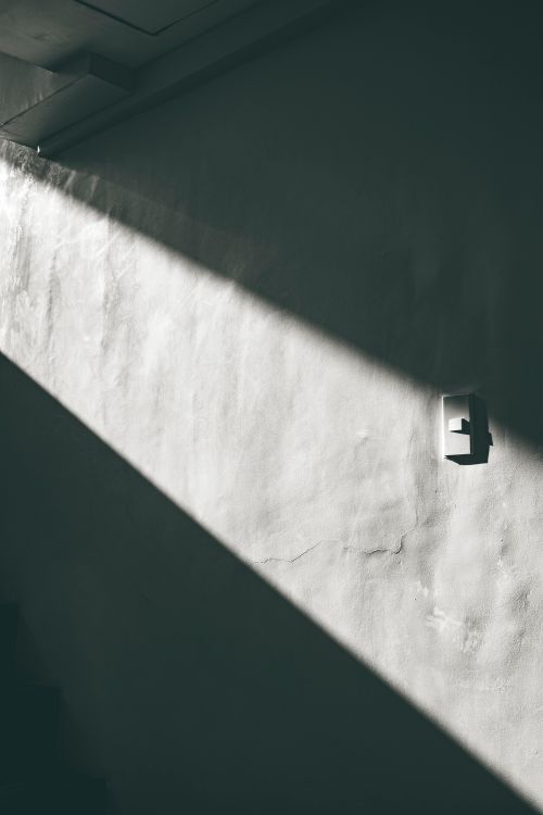 Bare plaster wall and doorway — photo by Nothing Ahead on Pexels