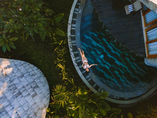 A Woman Lying Near the Pool