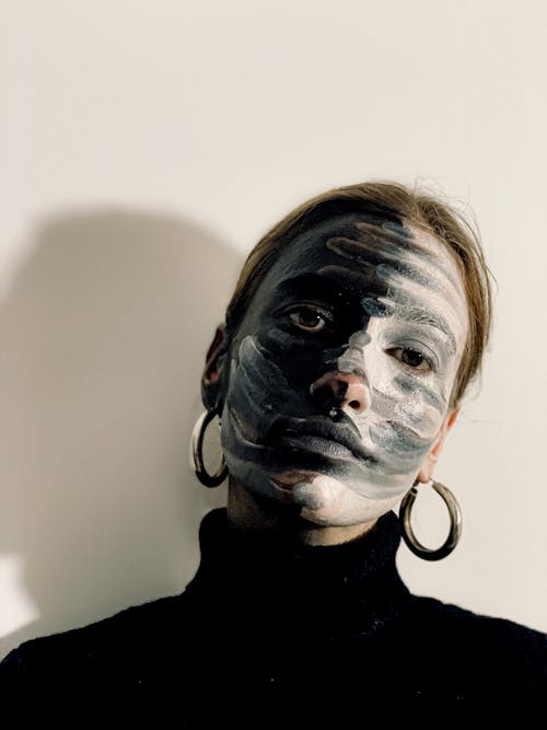 Young woman with paint art on face