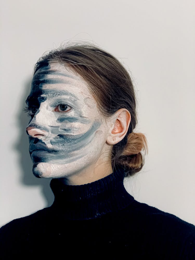 Young Mysterious Woman With Painted Face