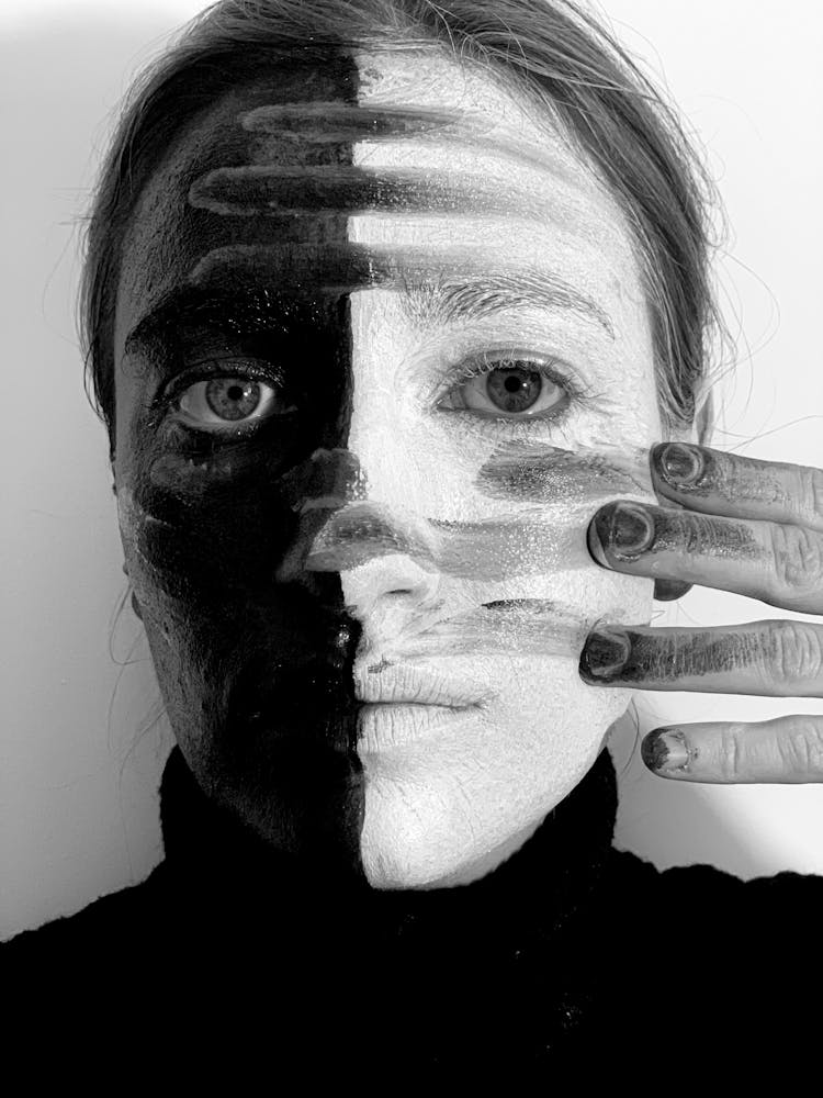 Young Woman Covering Face With Paint