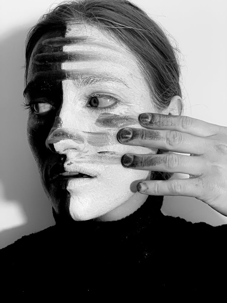 Strange Woman With Paint On Face And Hand