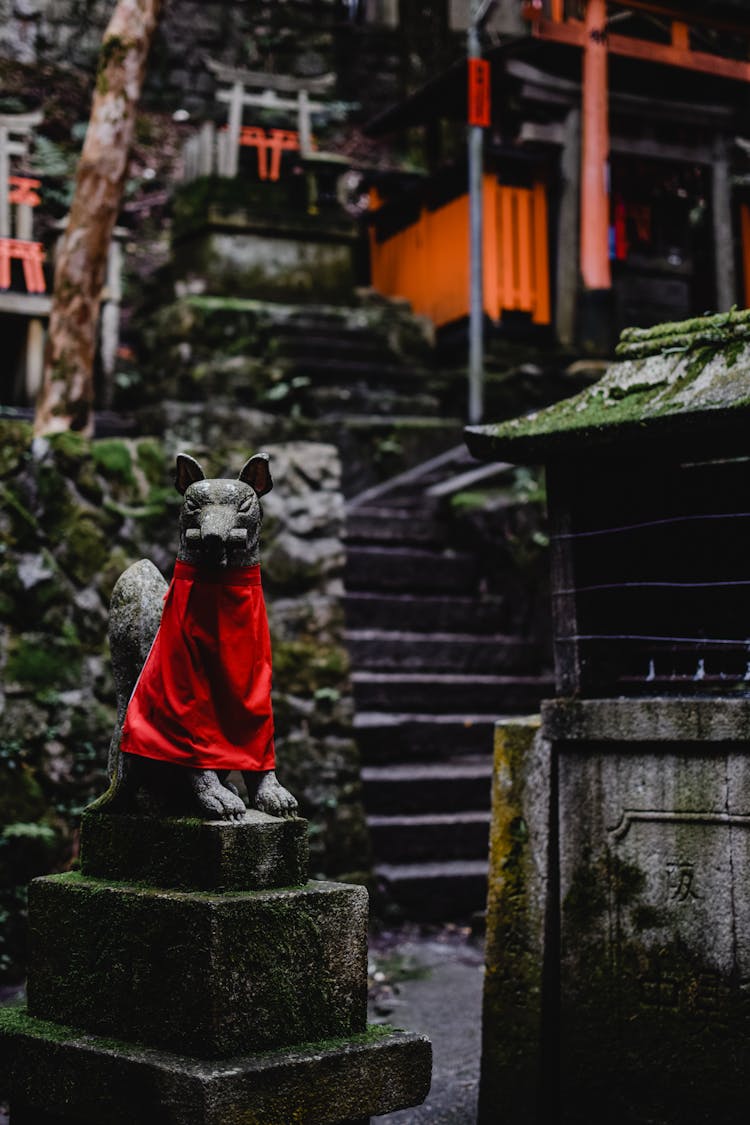 Gray Concrete Statue With Red Cloth