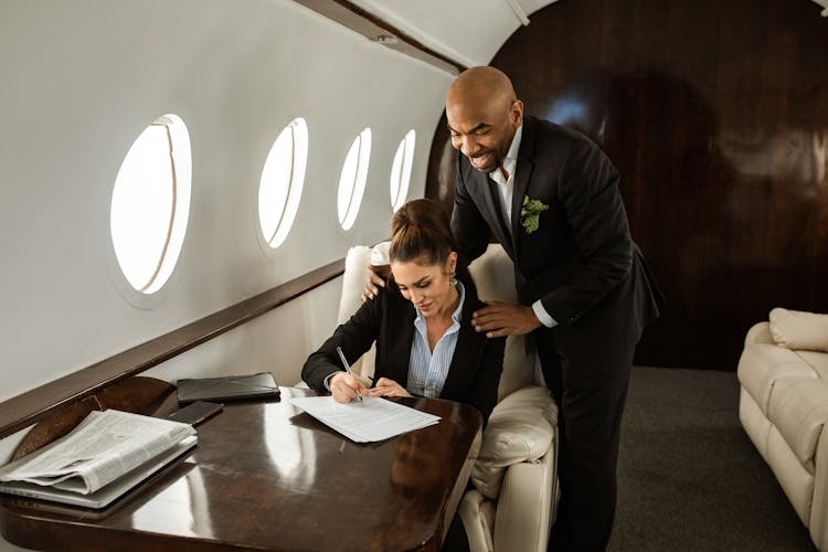 A Businesswoman Signing A Document