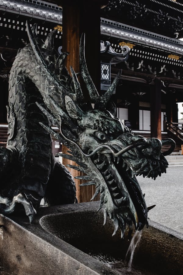 Black Dragon Statue Near Brown Building