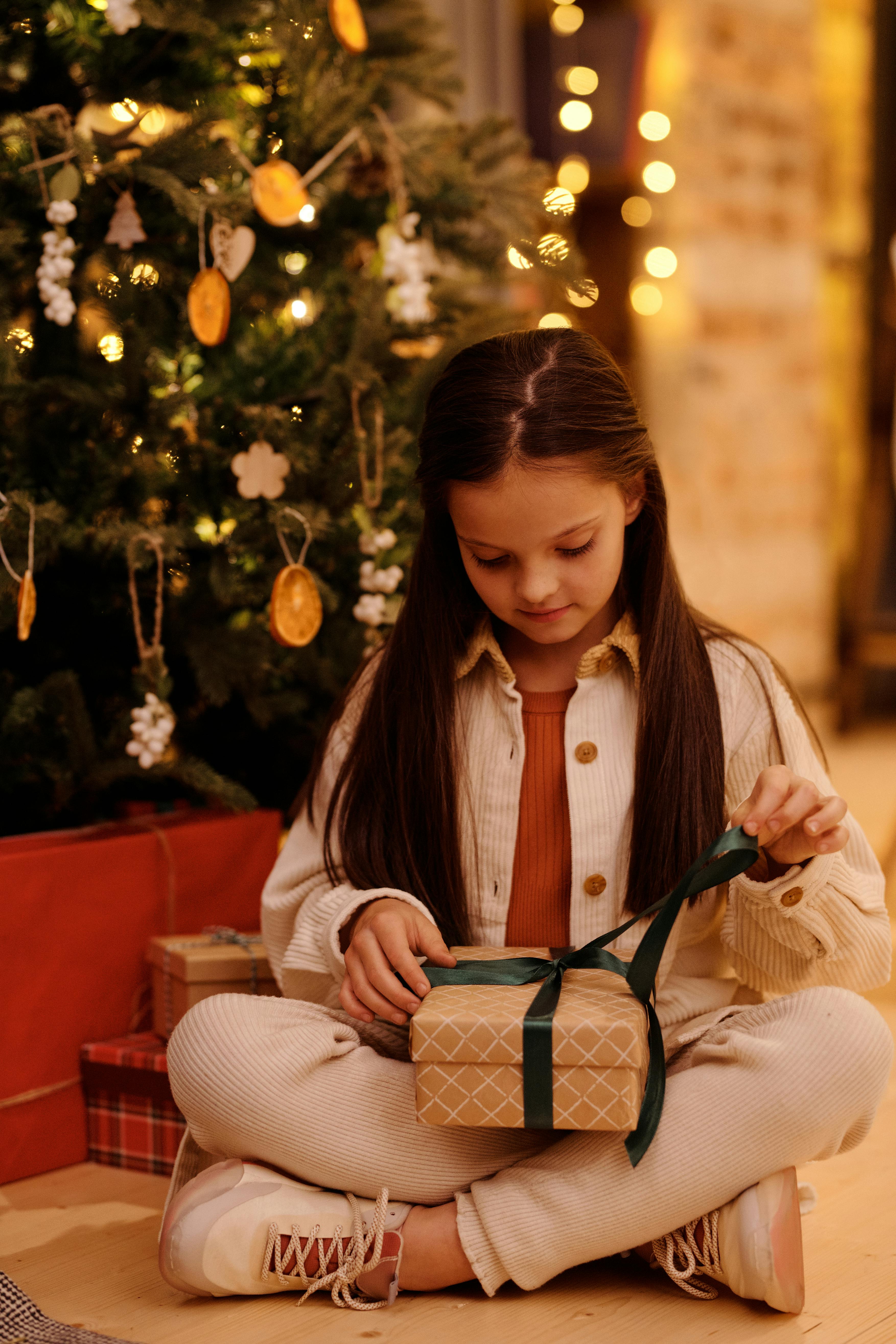 girl opening her christmas gift