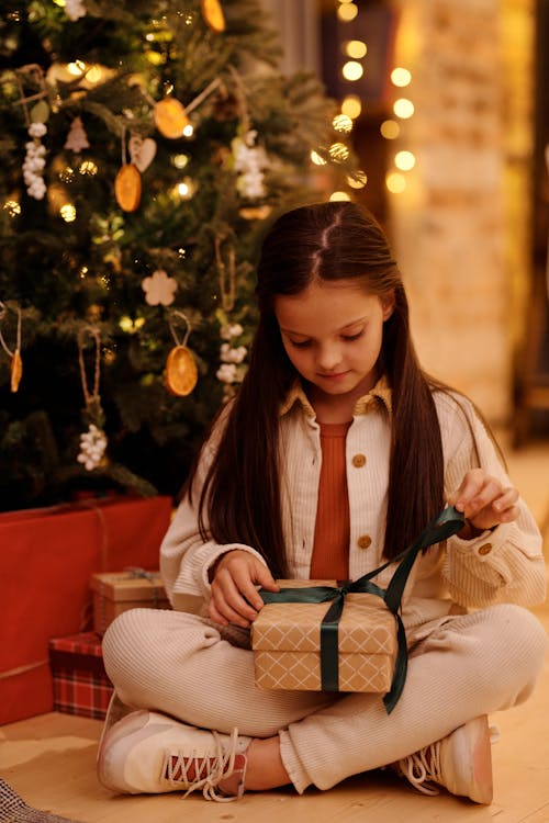 Girl Opening Her Christmas Gift