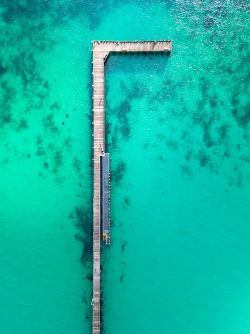 Aerial View of Wooden Dock on Body of Water