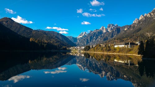 Scenic View of Dolomites near Calm Lake 