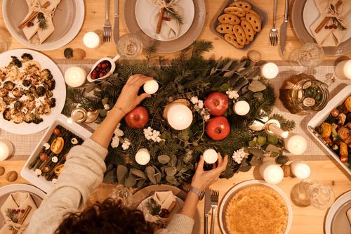 Free A top-down view of a festive holiday table setting with candles and decorations, perfect for Christmas or New Year's dinner. Stock Photo