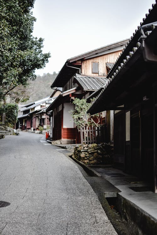 Asian Architecture Houses beside an Empty Street · Free Stock Photo