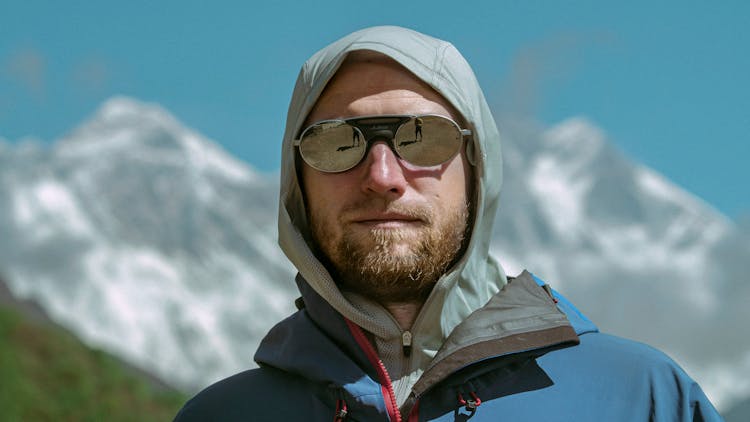 Portrait Of Man Posing With Glaciers On Background