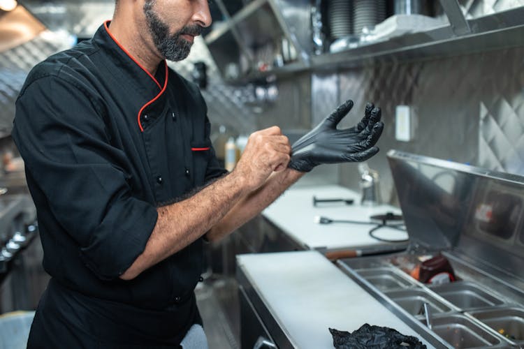 Man Putting On A Glove