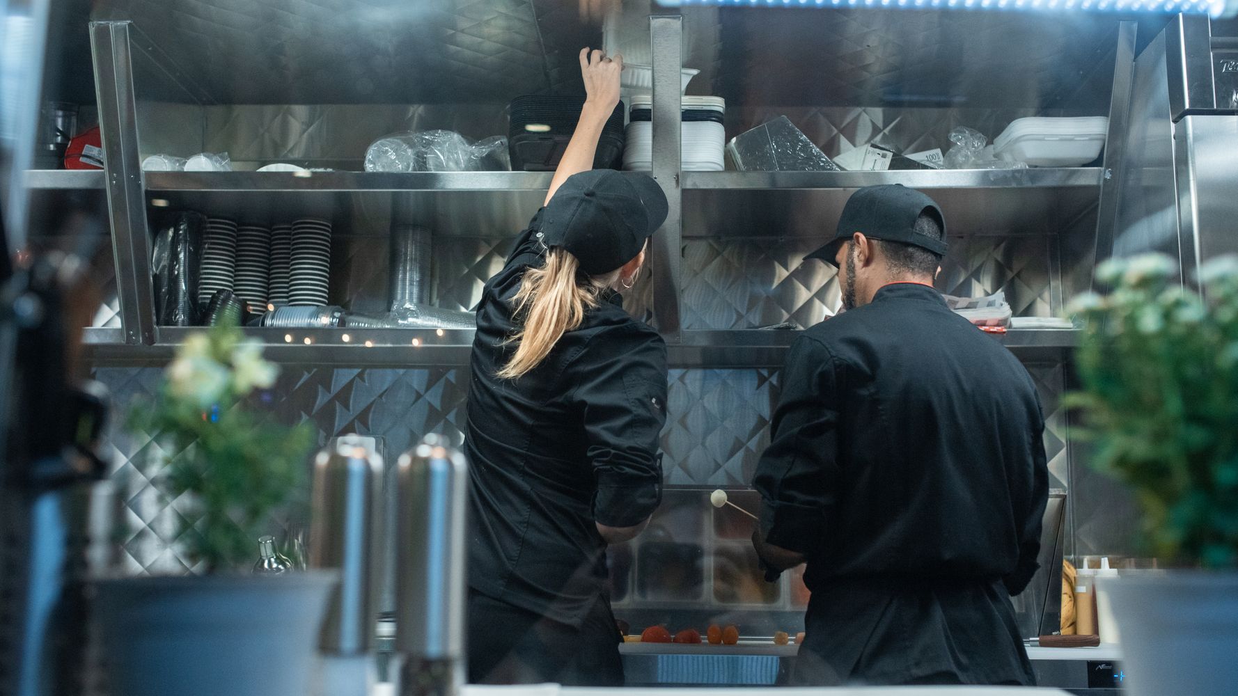 Professional chefs working in a commercial restaurant kitchen in Dubai