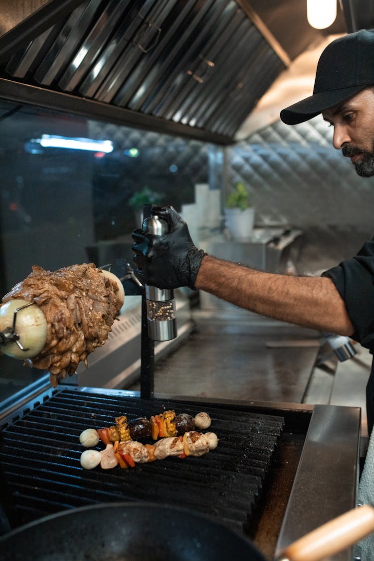 A Man Cooking Kebab