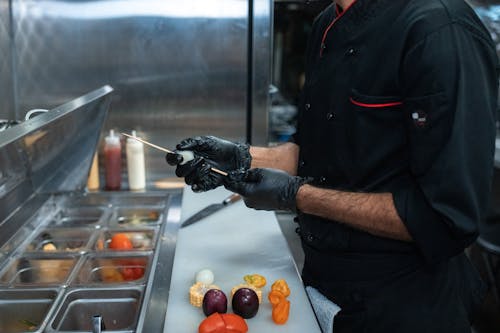 A Man Wearing Black Gloves