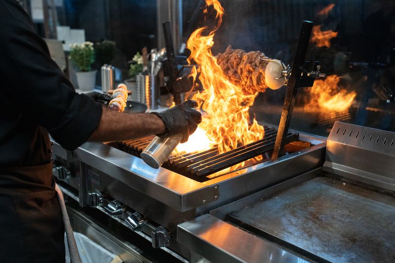 Chef working the flame grill