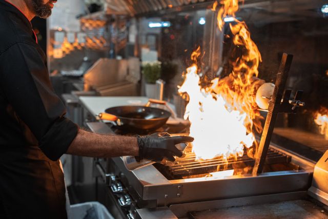 Chef cooking over open flame