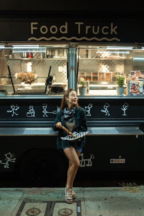 Woman holding a Deliciously Prepared Street Food