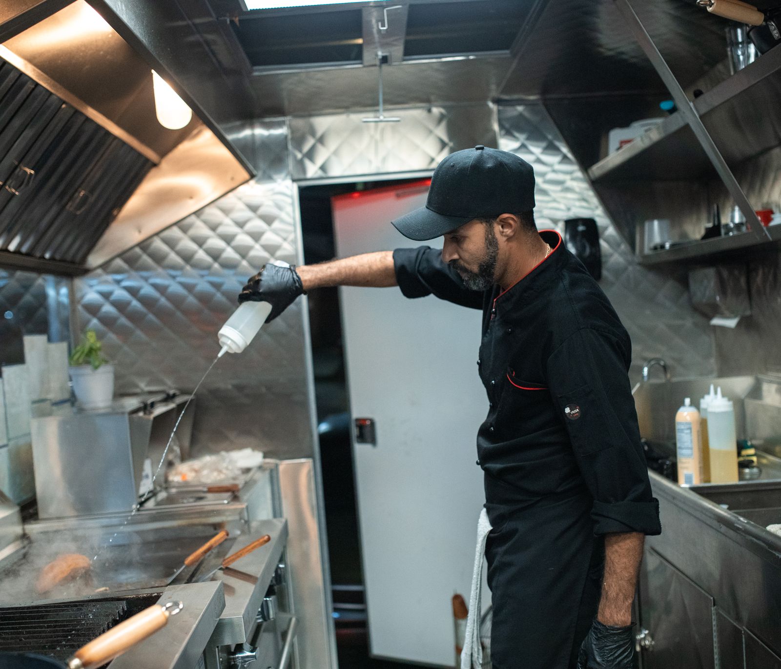 Chef cooking on commercial kitchen equipment in Dubai