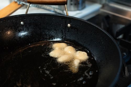 Free Golden doughnuts frying in a pan, captured with Canon EOS 5D Mark IV. Stock Photo