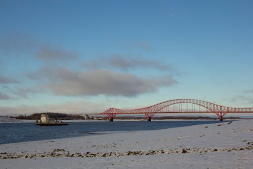 Free Red Bridge over the Sea Under Blue Sky Stock Photo