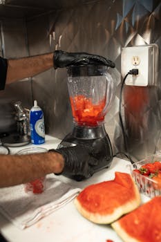 Close-up of fresh watermelon being blended, ideal for food blogs and smoothie enthusiasts.