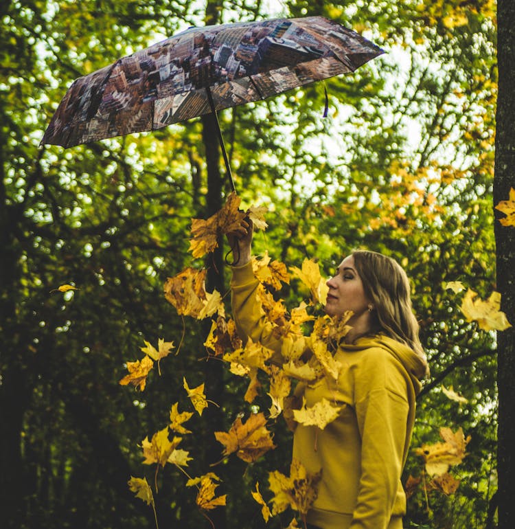 Woman In Yellow Jacket Holding Umbrella