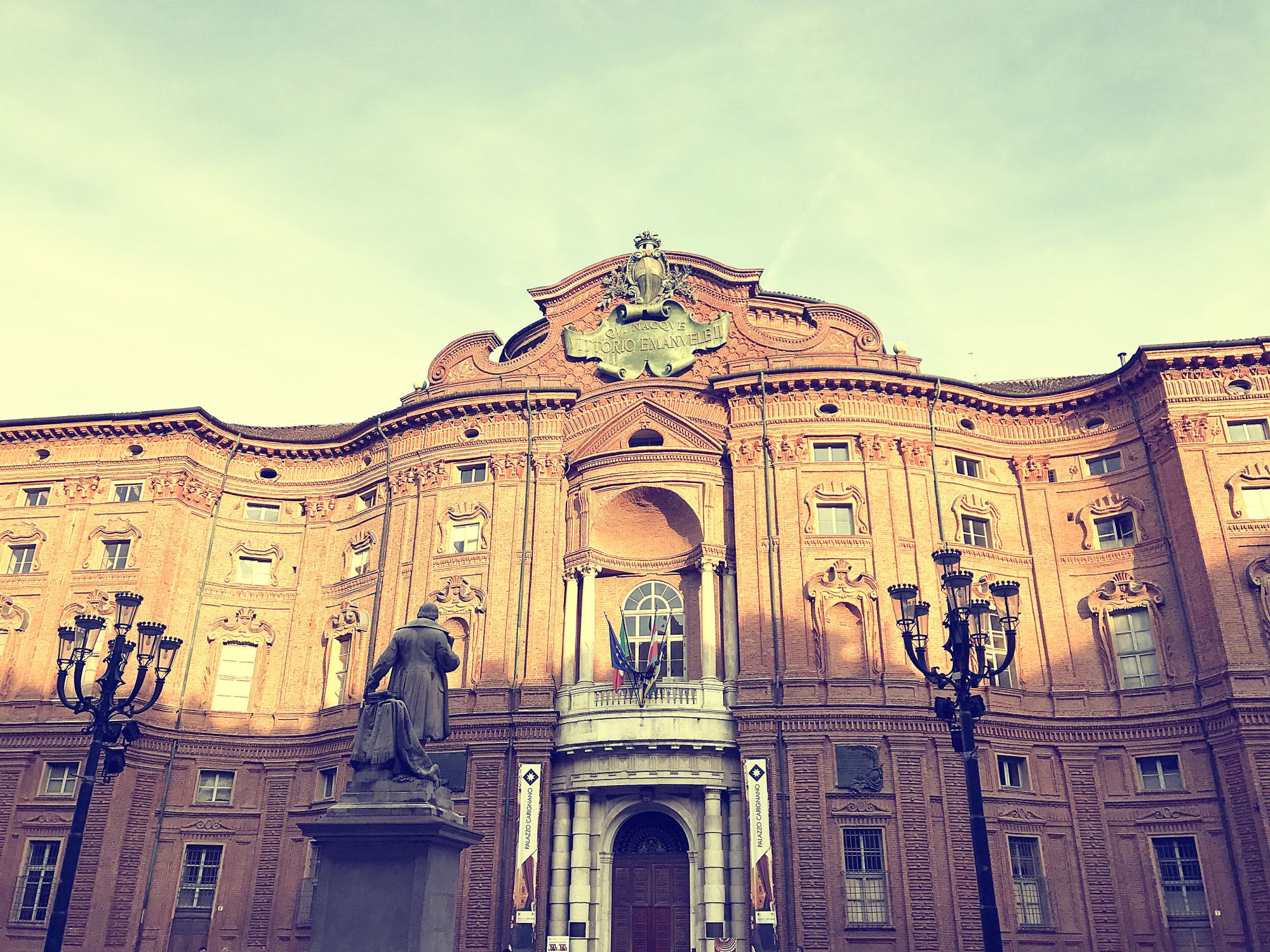 The historic Baroque architecture of Palazzo Carignano in Turin, Italy captured during the day.