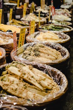 Variety of fermented vegetables on display at Nishiki Market in Kyoto, Japan.