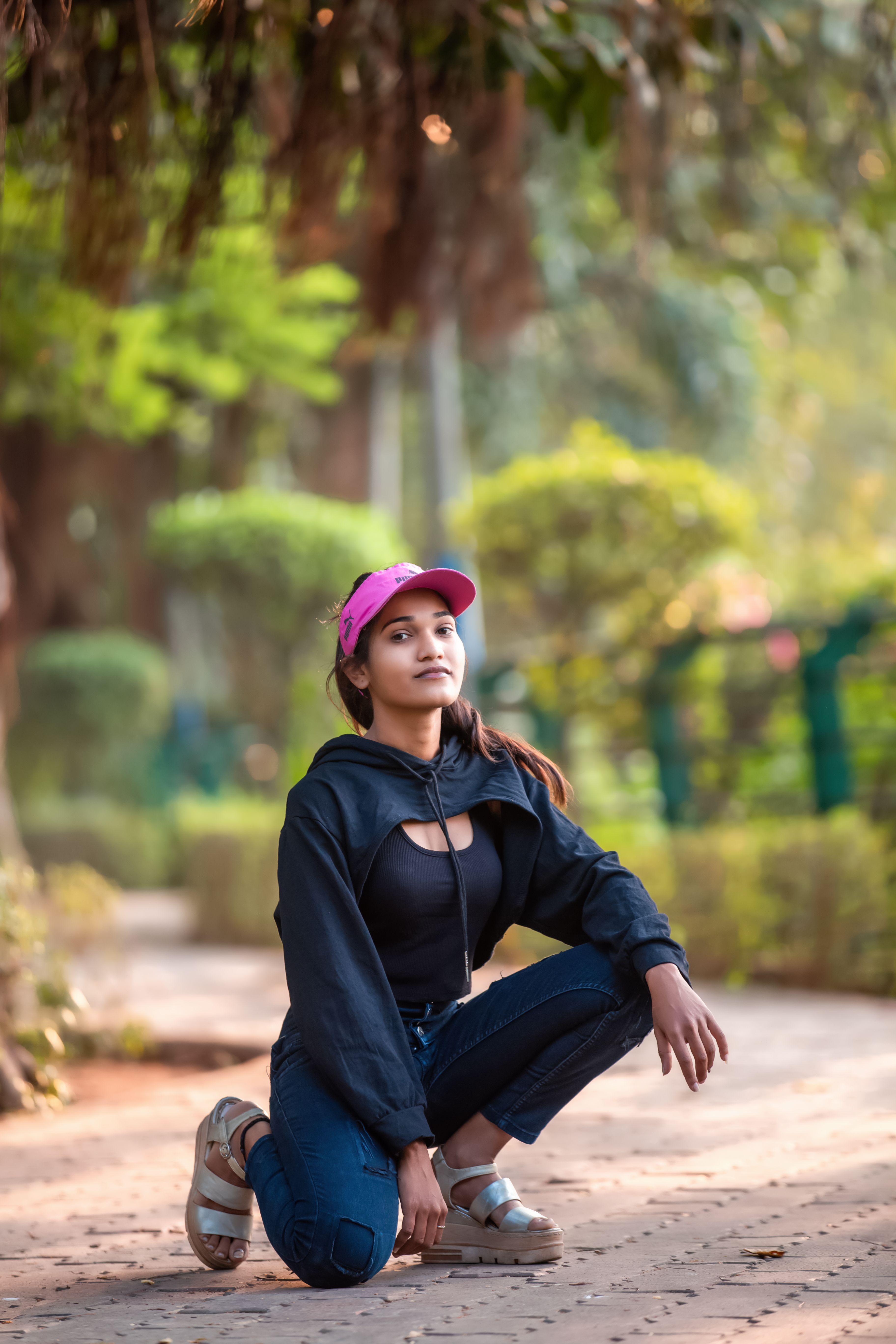 Woman in Black Jacket and Blue Denim Jeans Sitting on Pathway · Free ...