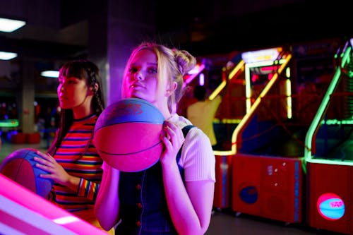 Friends Playing Basketball in an Amusement Center