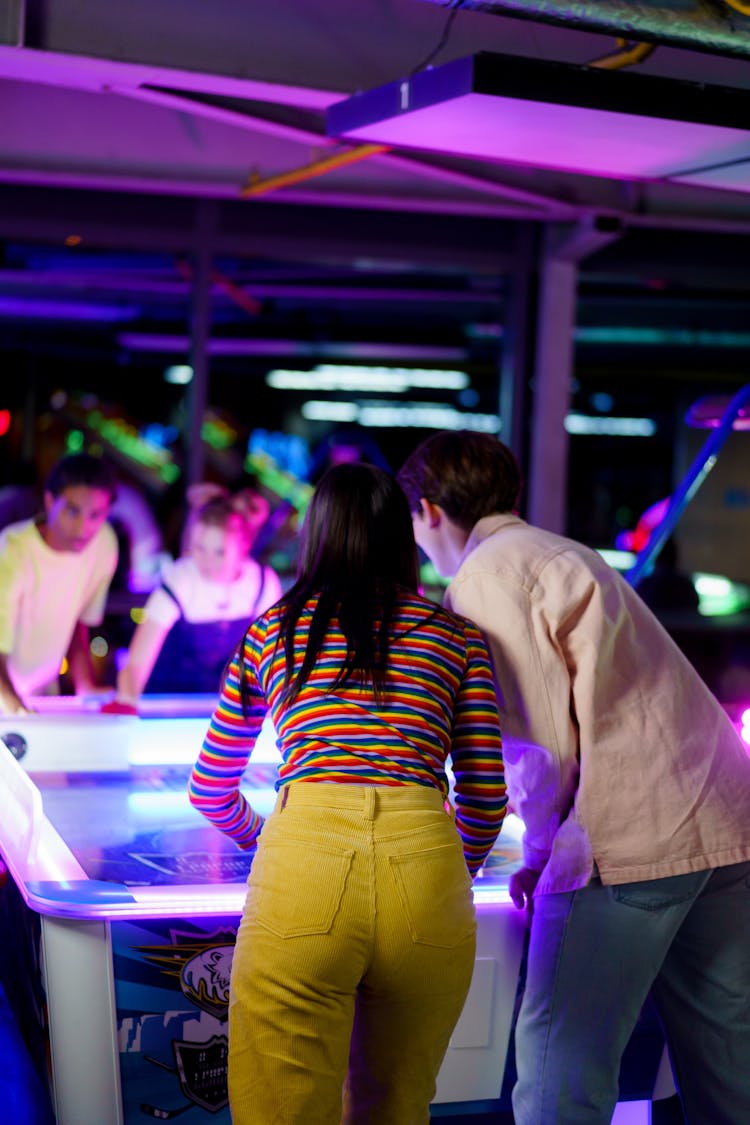 Friends Playing Air Hockey