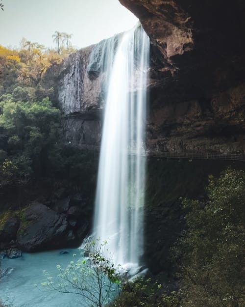 Free Waterfalls flowing from a Rock Formation  Stock Photo