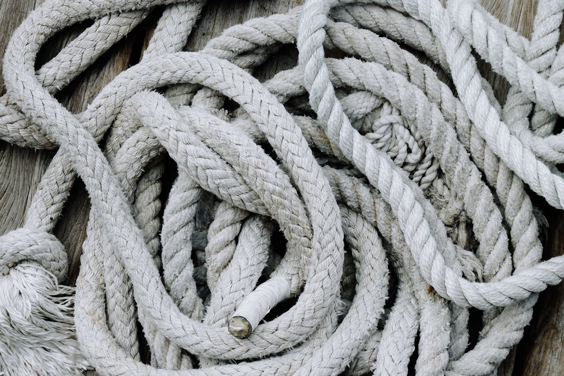 Free Rope placed on wooden surface Stock Photo