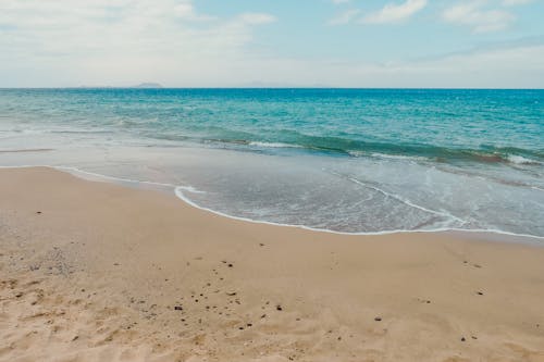 Sandy beach with rippling sea