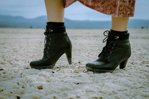 Free Person Wearing Black Leather Boots Stock Photo