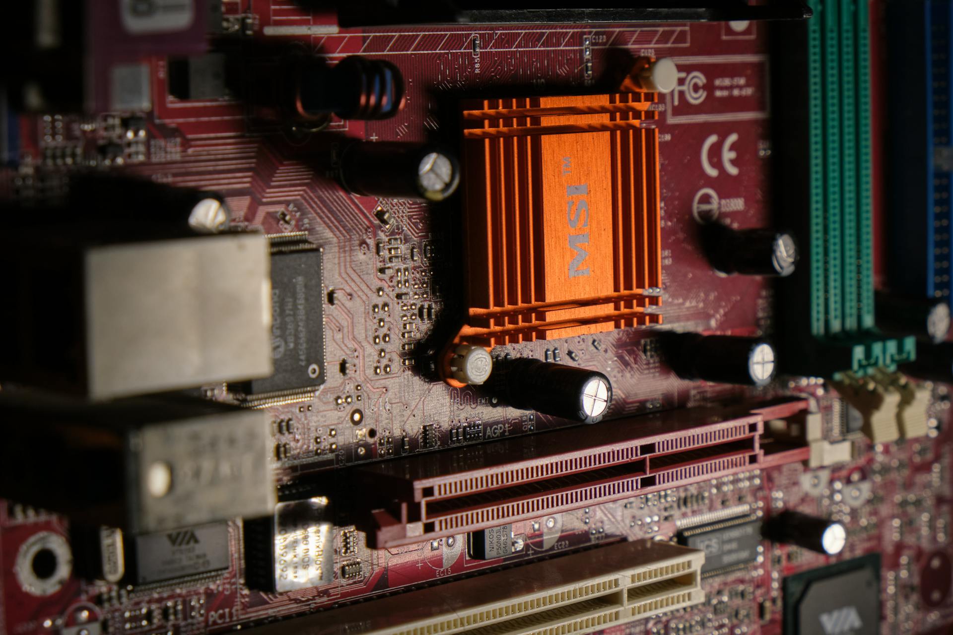 Detailed view of a computer motherboard showcasing intricate electronic components.