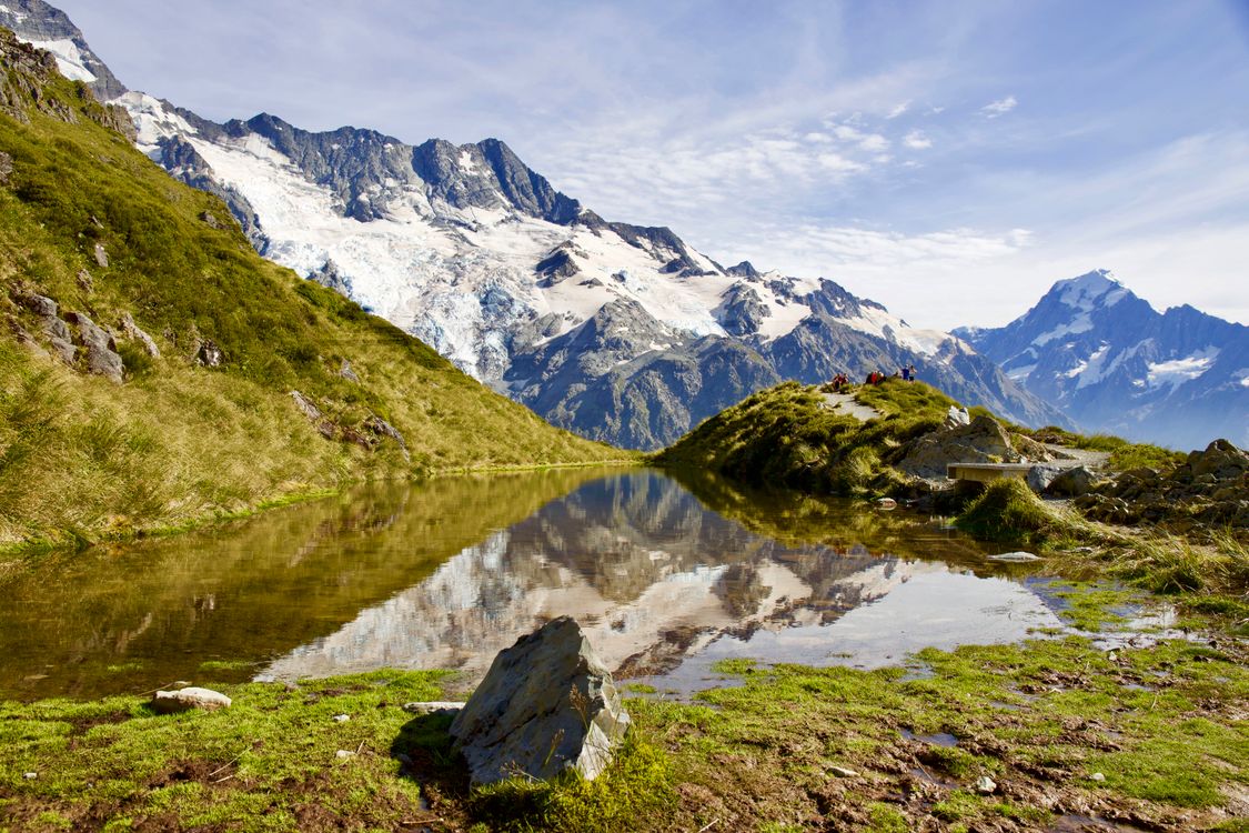 Mountain Near Lake Under Blue Sky · Free Stock Photo