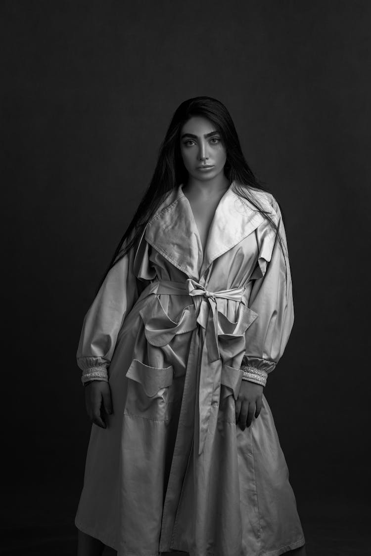 Black And White Portrait Of Woman In A Raincoat 