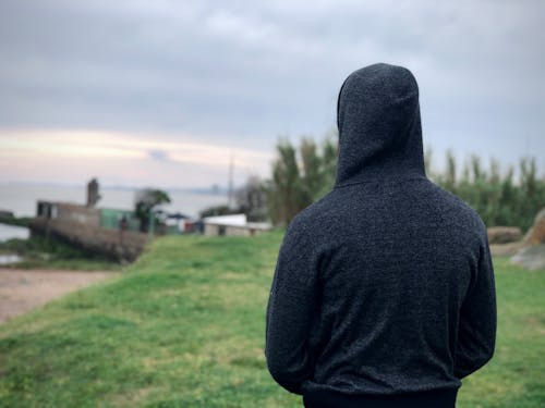 A Person in Gray Hoodie Standing