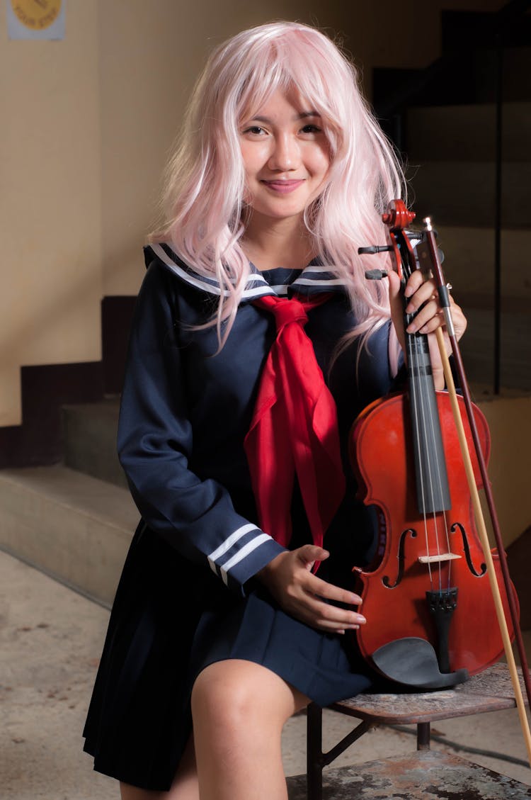 Beautiful Woman Holding A Violin