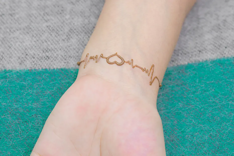 Detailed close-up of a vibrant temporary tattoo applied to wrist skin showing color and clarity