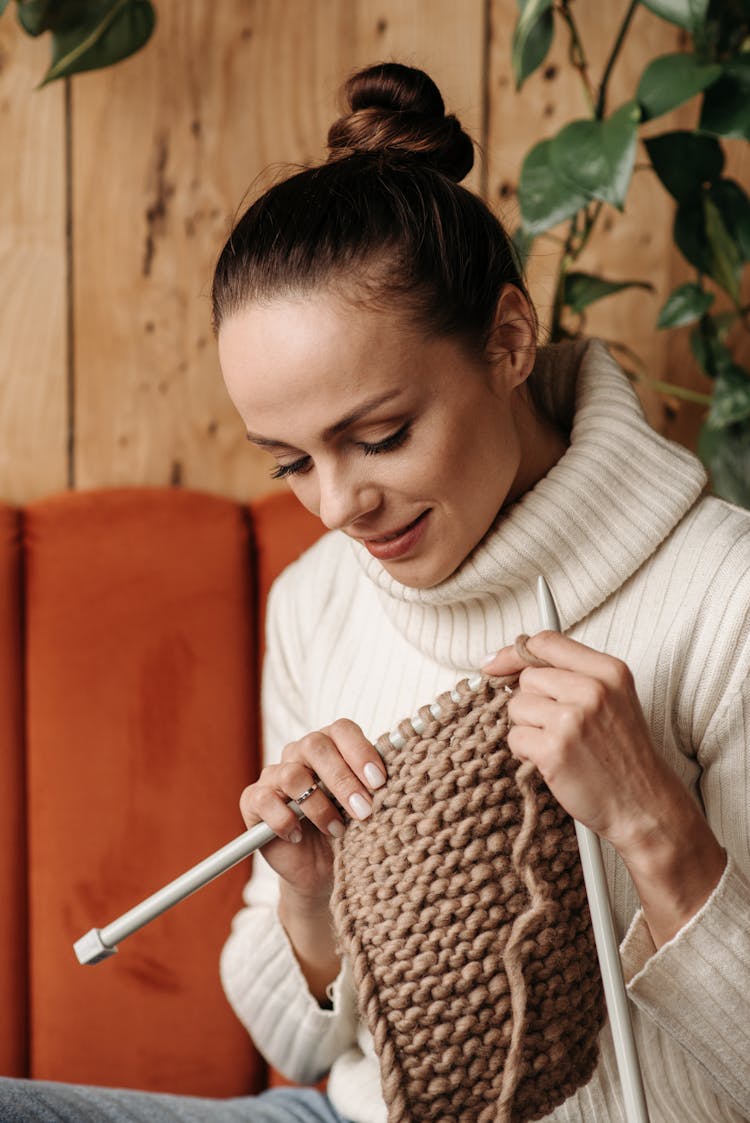 Woman In White Turtleneck Sweater Looking Down