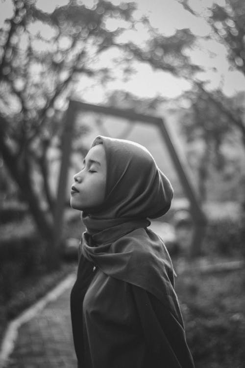 Black and White Side Portrait of a Young Woman in a Hijab 